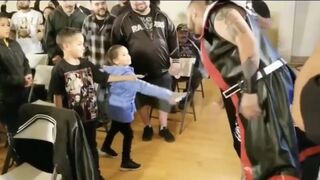 Little girl gets spat on by fake wrestlers!