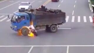 Motorcycle rider crashes into the side of a truck and explodes after piercing the gas tank!