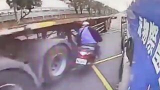 Scooter rider dismantled against the side of a truck!