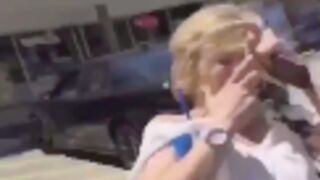 Woman gets slapped around the face for saying the N word!