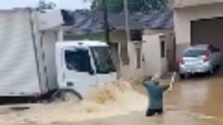 Man gets crushed by a van in a flood!