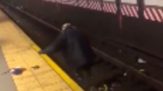 Man gets beat up and thrown on the subway tracks in new york!