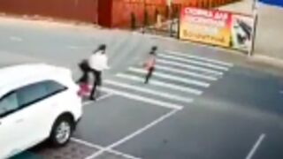 Boy runs across the street causing his mom to follow and she gets hit by a car!