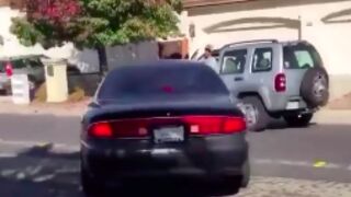 Man gets crushed against his car after getting into a road rage altercation!