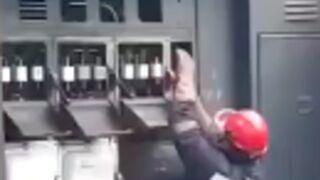 Man attempts to repair an electrical transformer!