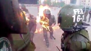 Two Police Officers Get Set On Fire By Molotov Cocktails Thrown By Protesters In Chile!