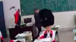 Teacher gets hit over the head with a hammer in china!