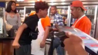 Kid tries to fight on man at a pizza shop for not giving him a slice