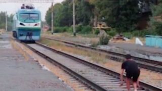 Lunatic Lies In Front Of Oncoming Train For Clout