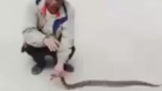 Man gets bitten by a snake and ends up with a nasty injury