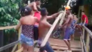 Teen receives a serious blow to the head with a plank of wood!