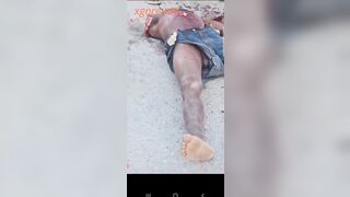 Video records the scene of a gang dismembering a man's body in Haiti