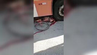 A man riding a bicycle was crushed by a bus