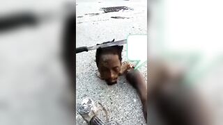 Haitian gang shows off a man's severed head and hand