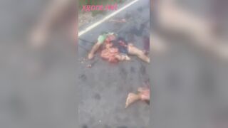 The crushed body of a man on the street