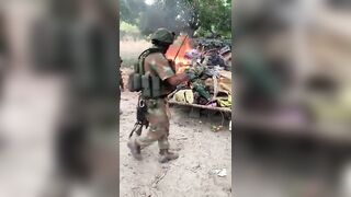 Burning corpses of soldiers in Mozambique