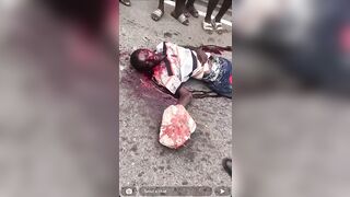 Gore video- Psychotic woman beats a man to death with a stone
