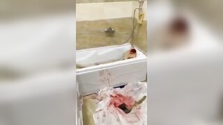 Dismembered video- Woman being dismembered in the bathtub