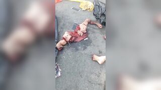 Gore video - They are collecting body pieces of a man on the street