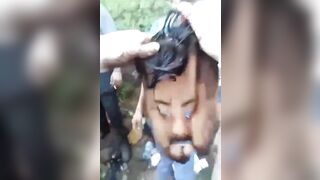 Gore video- Mexican drug gang peels off a man's face and uses it as a mask to make fun of him