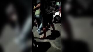 Lady executed in a street fight (action & upshot).