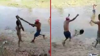 Man hits woman over the head with a log then discards her into river - Miranda, Venezuela