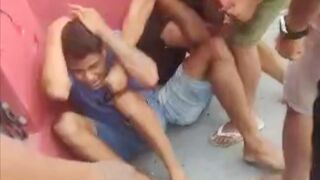 Two bandits are captured and beaten by members of the public - Manaus, Brazil