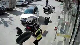 Security guard is taken out by runaway tyre - China