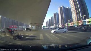 Man In China Buffs The Top Of A Stangers Car