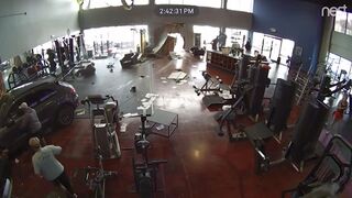 SUV crashing through Dallas gym's wall, striking two people