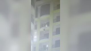 Distraught man jumps from balcony after getting caught up in overseas scam and trying to get home (2 angles & aftermath).