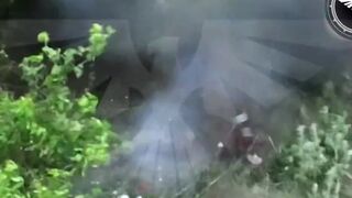 Russian soldier puts grenade under his shirt