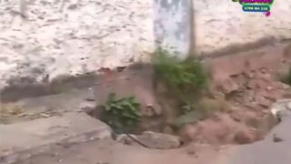 Idiot Falls into Sinkhole - on Live TV