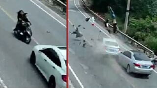Two people are brutally hit off motorcycle after a failed passing by oncoming car - China