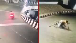 Speeding motorcyclist is ejected off flyover after colliding with divider - China