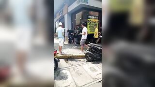 Robber chased after by terrible mob and also wounded in the back