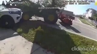 Guy On Tractor Runs Into Police Cruiser