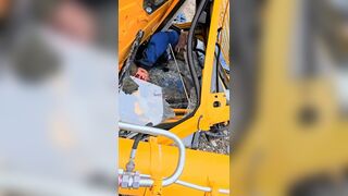 Fallen Crane Operator Asks For A Lighter In Dagestan, Russia