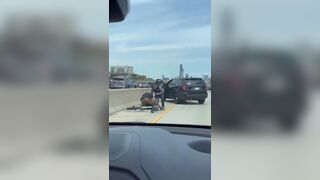 Cop tackles a man off stolen bike on a Chicago expressway