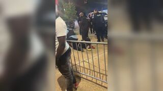 SLMPD officer lighting cigar while arresting man