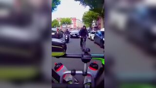 He tries to steal a bike from a moving car