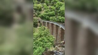 Couple Jumps From 90-Feet Rail Bridge During Photo Shoot