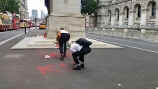 Protestors spray paint war memorial in London, UK