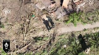 Two soldiers standing still to avoid drone detection and getting hit anyway