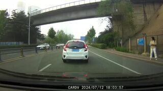 Mna Leaps From  An Overpass In China