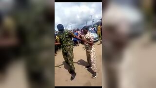 Nigerian Soldiers Beating Young Man In Public For Wearing Camouflage