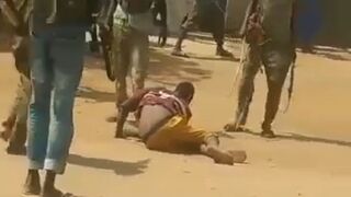 Janjaweed militia drag civilian into the street then execute him with an assault rifle - Sudan