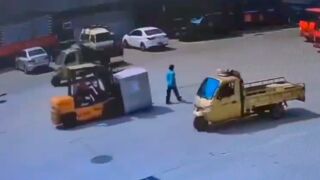 Oblivious woman gets crushed by a forklift whilst crossing the street - China