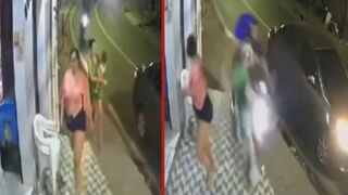 Speeding motorcyclist runs over a woman holding a baby after getting obstructed by a parked car - Brazil