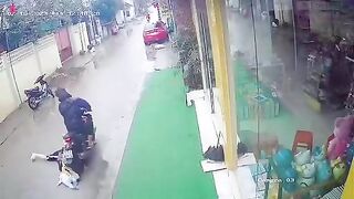 Woman sucked into motorcycle, Video. Vietnam.